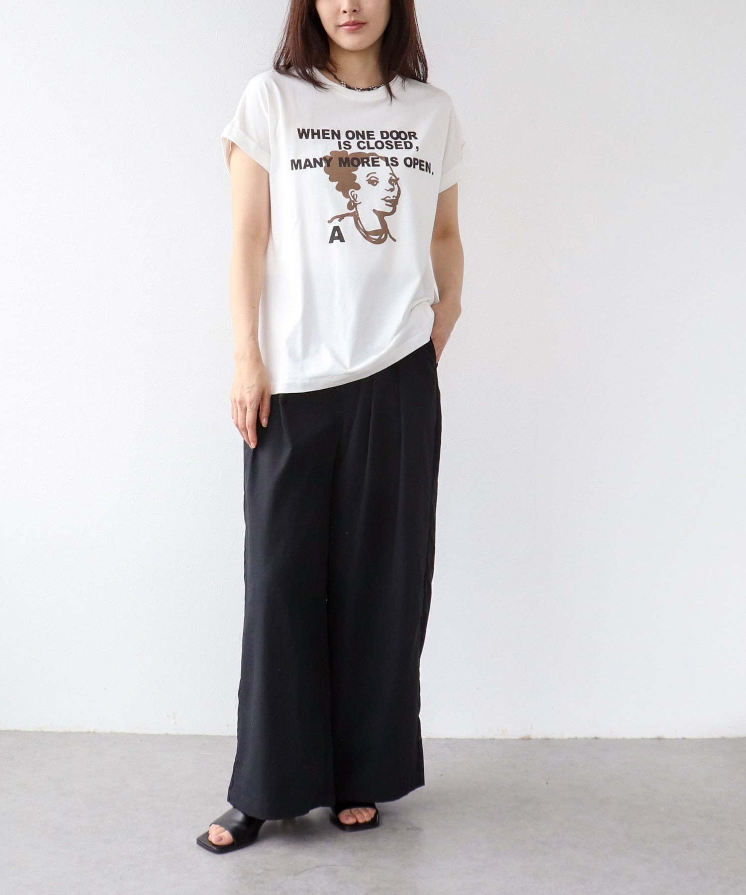 フェイスモチーフプリントドルマンTシャツ