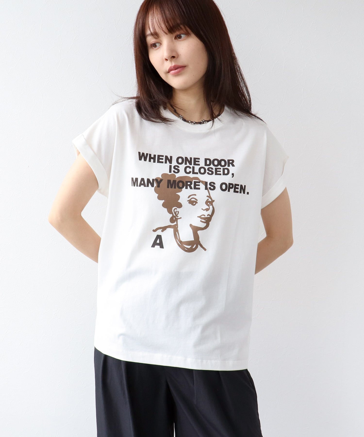 フェイスモチーフプリントドルマンTシャツ