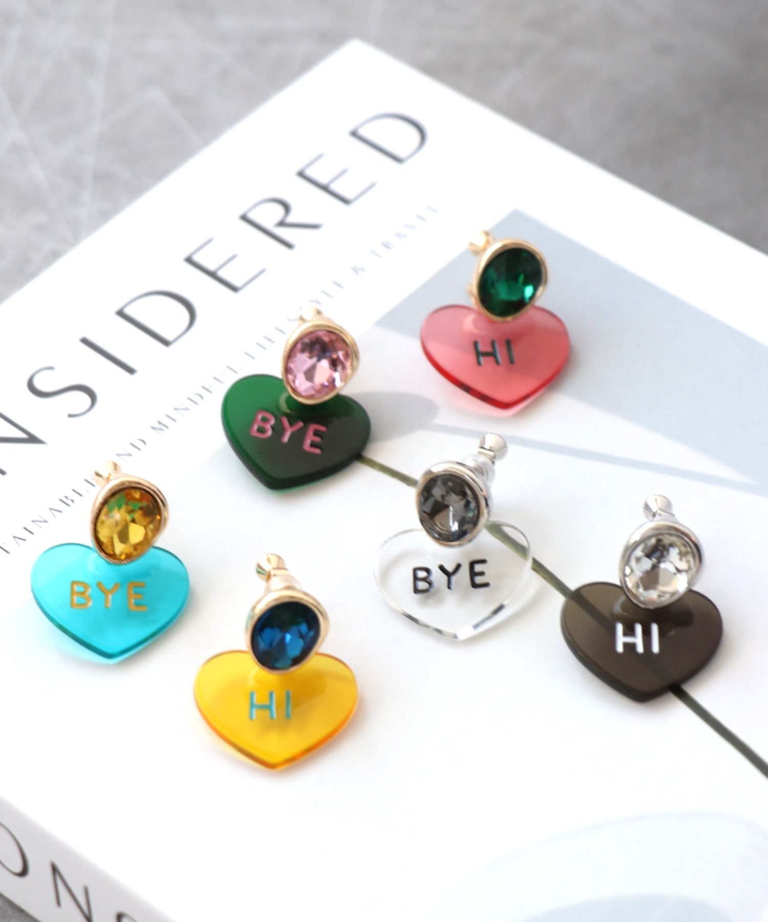Hi/BYEクリアハートイヤリング