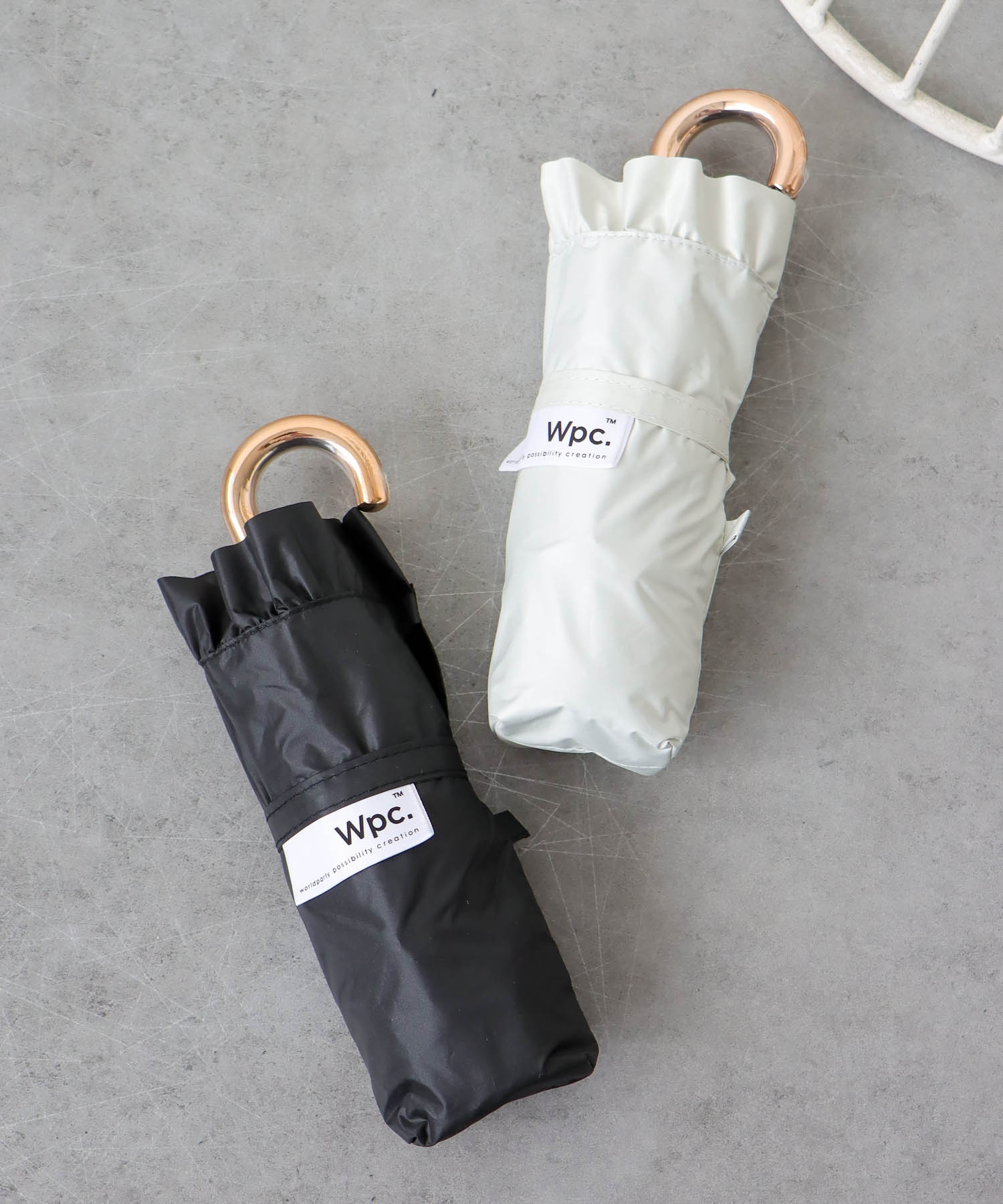 【Wpc.】≪晴雨兼用/遮光≫COMPACT FRILL 4段折傘