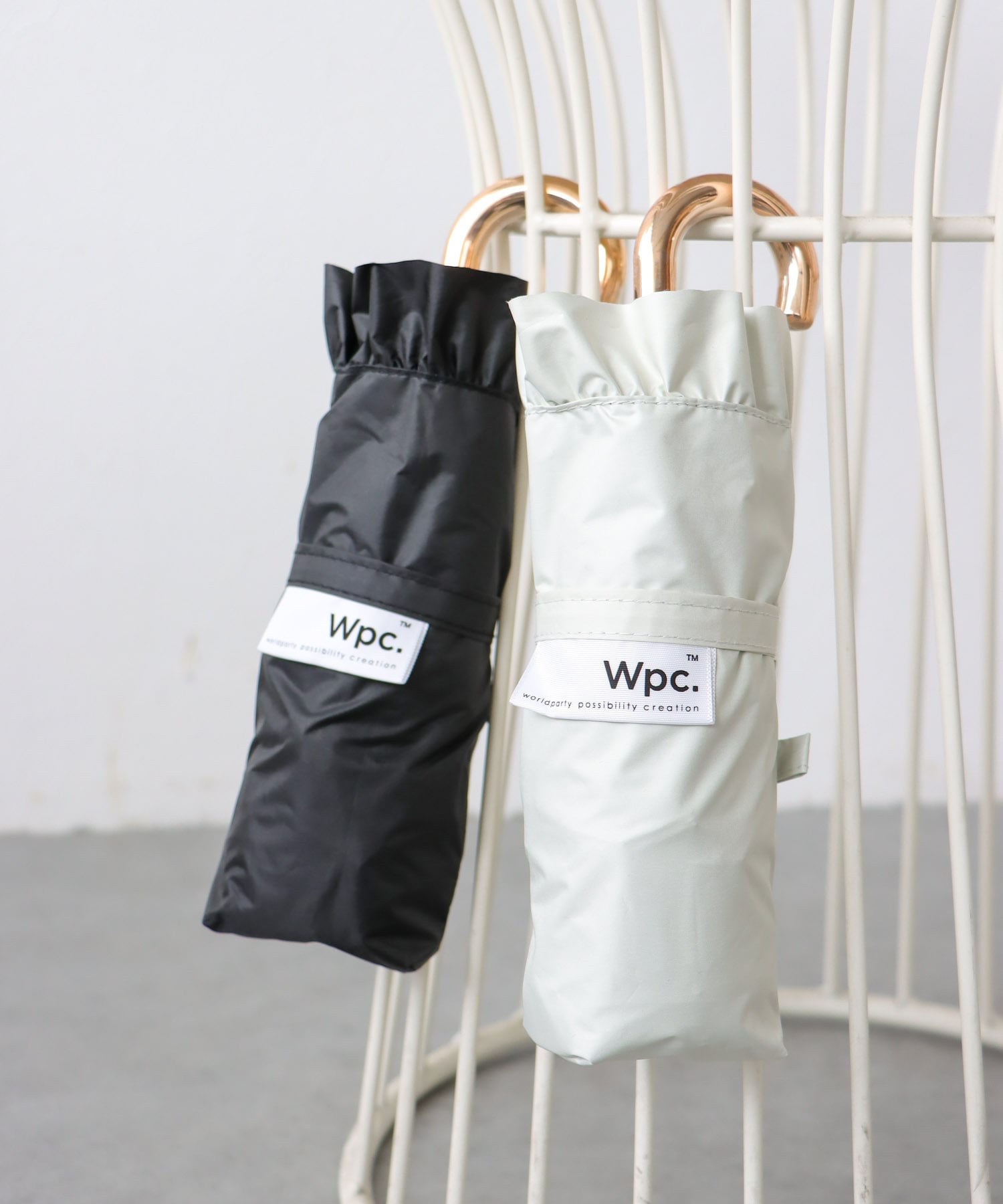 【Wpc.】≪晴雨兼用/遮光≫COMPACT FRILL 4段折傘