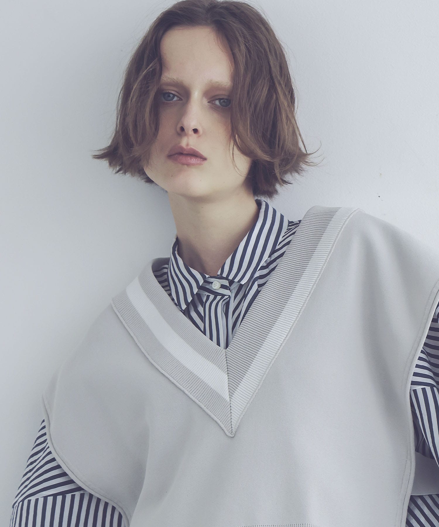 white line V neck vest
